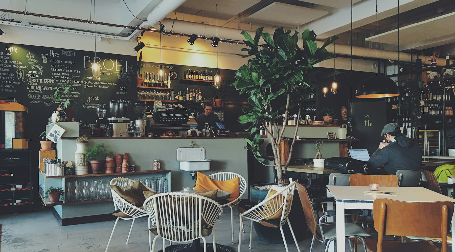 Bright, airy interior of Bean & Brew café with wooden tables